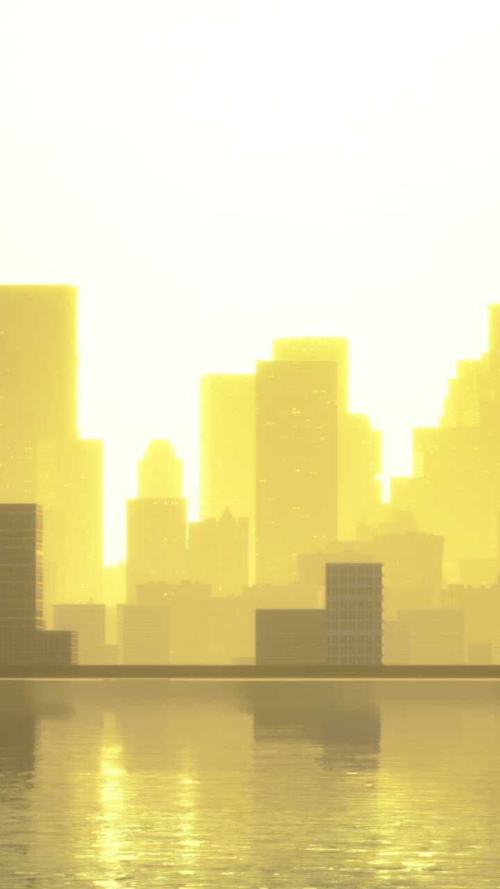 Skyline della città illuminato dalla luce dorata del sole sulle acque calme all'alba