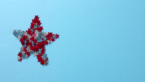 Star-shape-of-red-and-blue-stars-lying-on-blue-background-with-copy-space