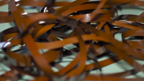 tape unreel. pulling the tape out. destroying cassette tape media. scene d
