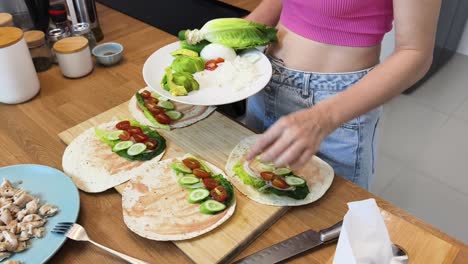 woman preparing healthy wraps