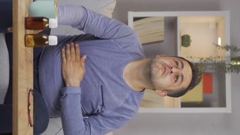 Vertical-video-of-Man-experiencing-stomachache.