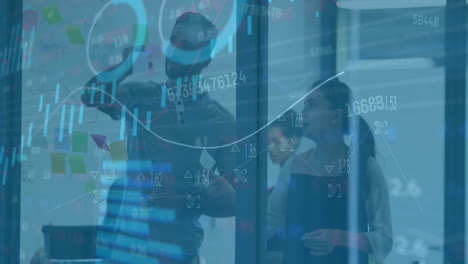 animation of diagrams and data processing over diverse colleagues talking in office