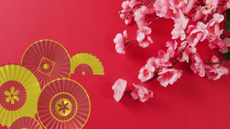 animation of chinese pattern and flowers with copy space on red background