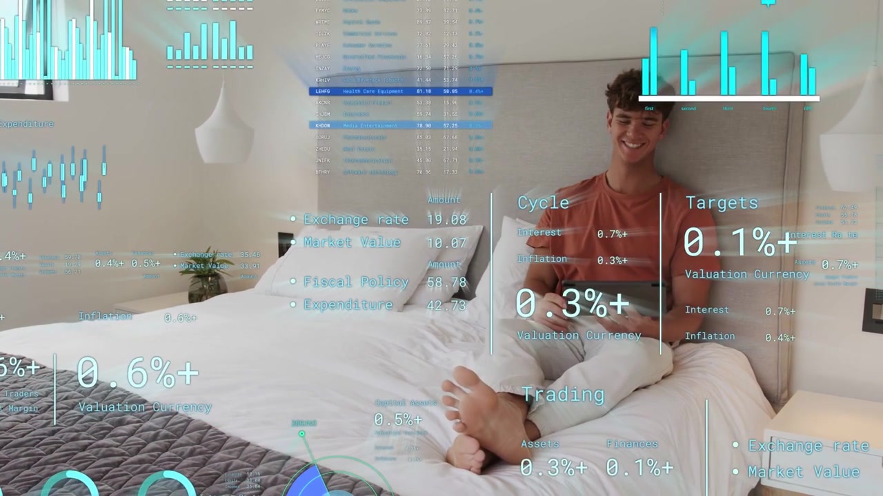 Male in 20s sitting on bed wearing rust-orange T-shirt tapping tablet with AR charts floating