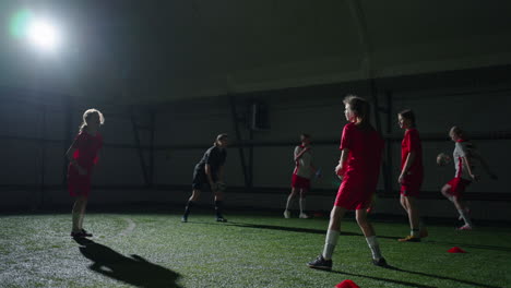 young girls soccer players practicing indoors