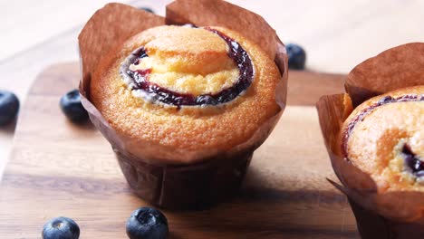 blueberry muffins on a wooden board