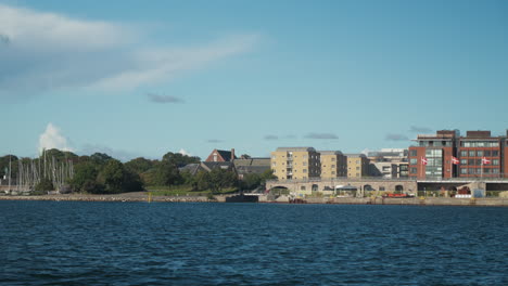 scenic waterfront view of copenhagen cityscape. ideal for travel documentaries and promotional content.