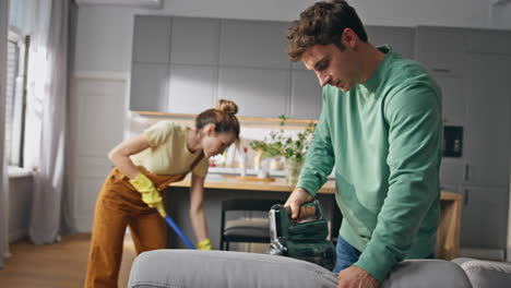 cleaning service team couple disinfecting room. two people domestic routine