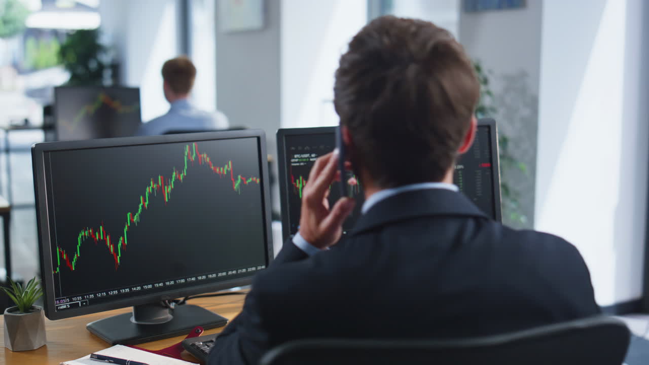 Forex broker talking mobile phone discussing market growth at office closeup