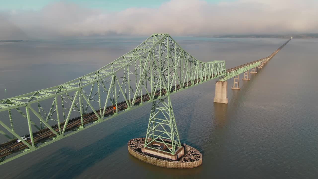 4K Aerial Big steel bridge on Columbia river in Oregon Drone dolly out + left pan shot