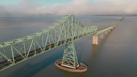 4k aerial big steel bridge on columbia river in oregon drone dolly out + left pan shot