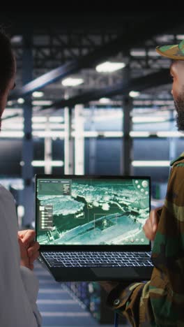 vertical video drone operators in military data center supervising autonomous flight systems