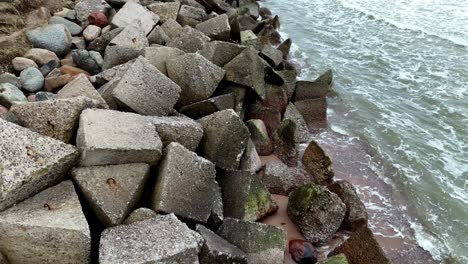 concrete blocks along the seashore in baltic sea in uzava, latvia, europe