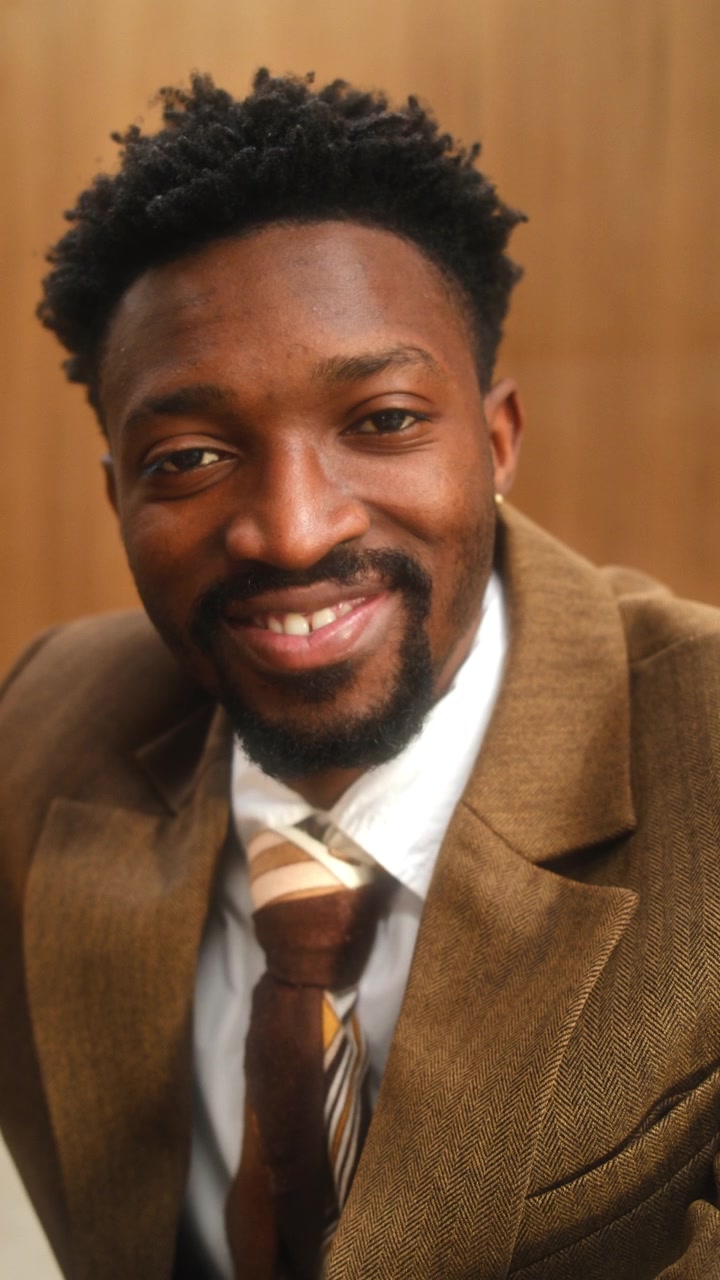 Portrait of Smiling African American Entrepreneur in Stylish Business Suit