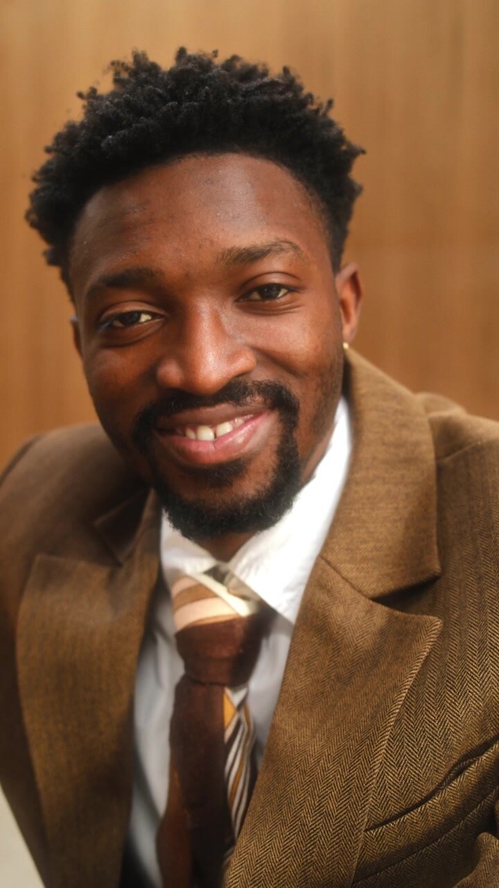 Portrait of Smiling African American Entrepreneur in Stylish Business Suit