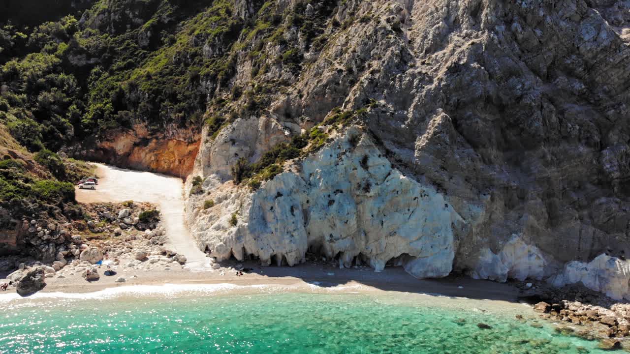 Scenic View Of Sandy Beach With Rocky Cliffs At Agia Eleni In Greece - aerial drone shot