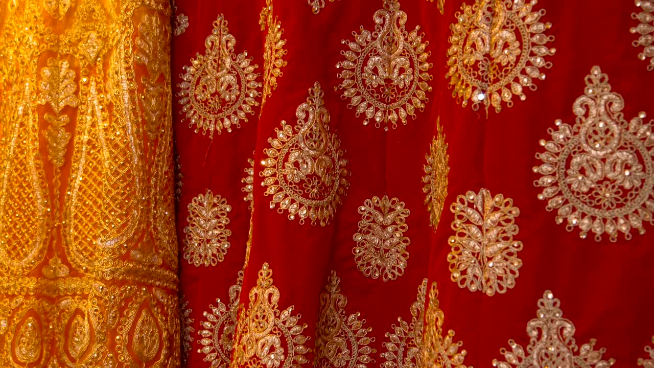 Beautiful colorful fabrics with traditional embroidery in the shop