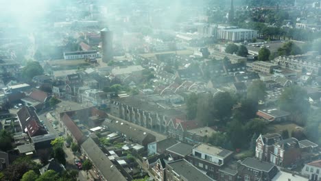 aerial shot of a fire burning in a dutch shed located in a neighbourhood