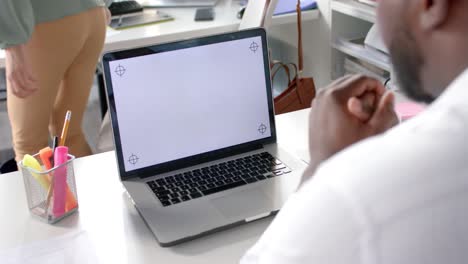 African-american-casual-businessman-having-laptop-video-call-with-copy-space-on-screen,-slow-motion