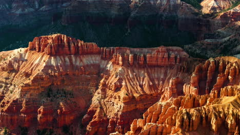 telephoto drone shot tilting over rugged nature, in bryce canyon, golden hour in usa