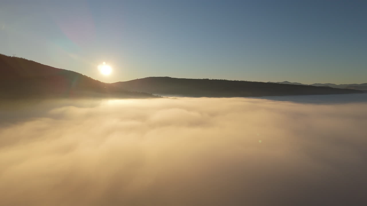 Foggy Sunrise Over the Mountains