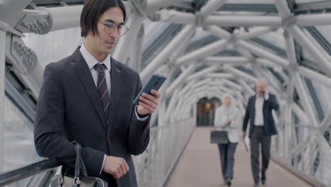 businesspeople on a city bridge
