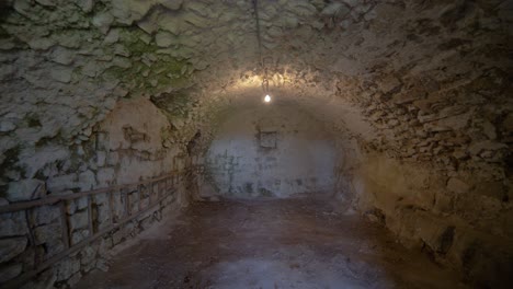 moving shot in an old empty stone wine cellar vault in old house in france