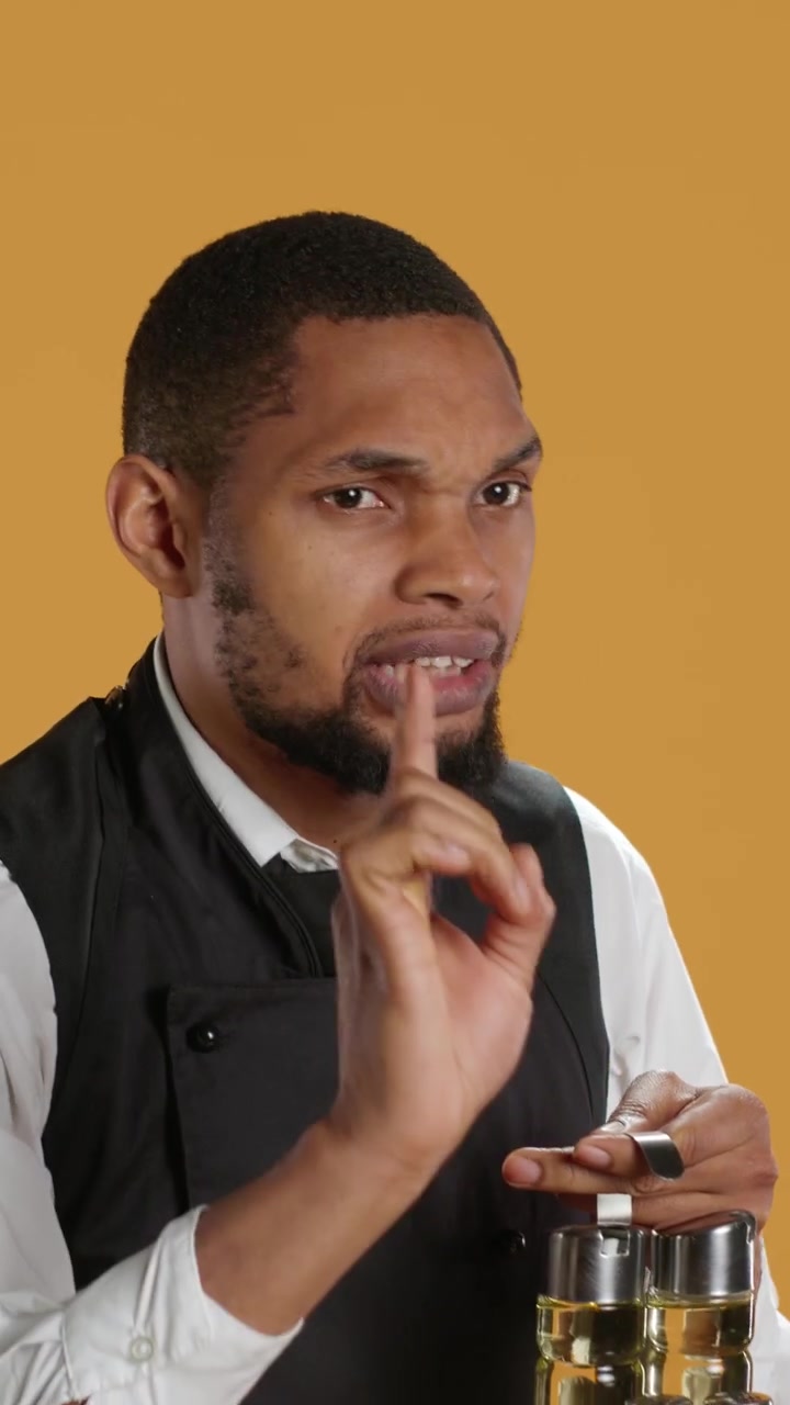 Expressive Chef Holding Spice Rack and Making Warning Gestures