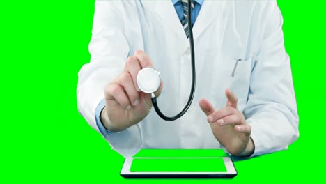 Doctor-examining-with-stethoscope-while-using-digital-tablet