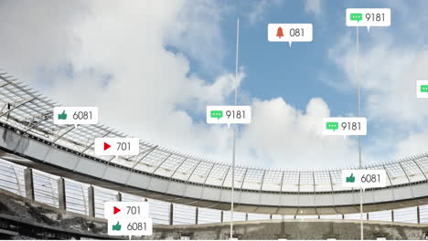 Animation-Von-Social-Media-Symbolen,-Die-Vor-Einem-Sportstadion-Und-Blauem-Himmel-Schweben