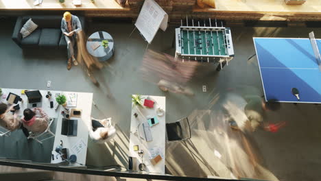 busy office space with people working and relaxing