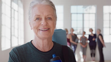 portrait happy elderly caucasian woman enjoying yoga class smiling cheerful middle aged female practicing healthy fitness lifestyle in workout studio
