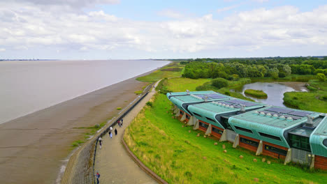 aerial drone video showcases humber bridge: 12th largest suspension span globally, over river humber, connecting lincolnshire to humberside with traffic