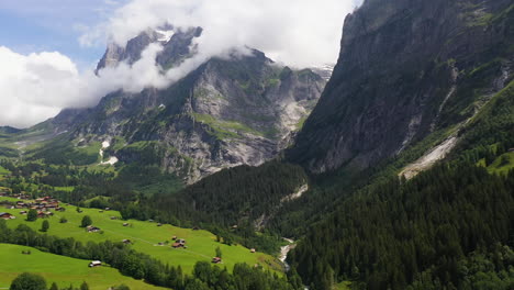 rotating done shot flying over grindelwald, in switzerland’s bernese alps