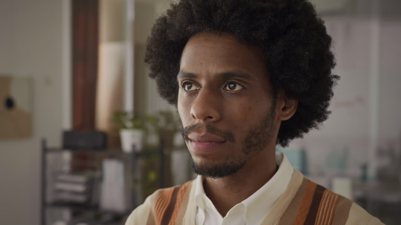 Portrait of Black Employee Posing with Toothy Smile at Office