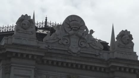 tilt reveal close up shot of front of famous bank of spain building, madrid