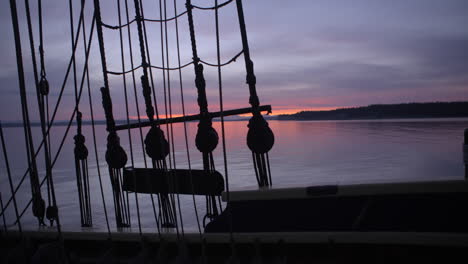 1700s sailing ship underway at sunrise