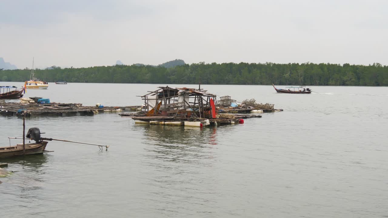 Fishing village on Koh Panyee, Thailand with wooden boats and floating homes