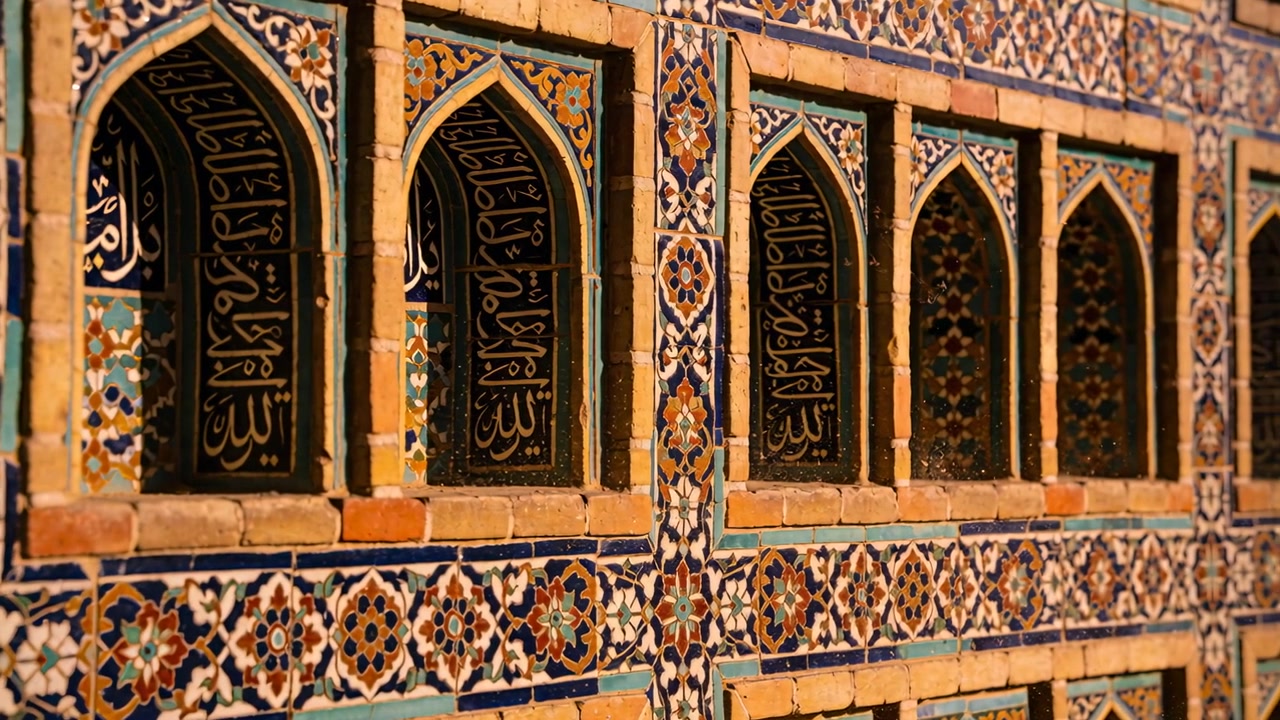 Sliding camera revealing tiled facade at mosque, showing pointed-arch niches, black Arabic panels