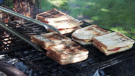 cheese,tomato and onion sandwiches grilling on a barbecue in south africa