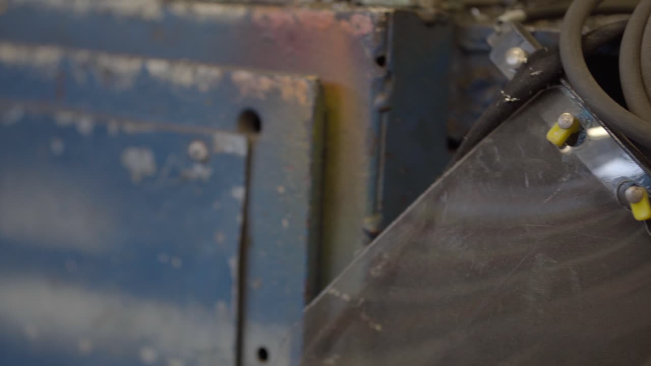 Closeup shot of metal parts, tools and equipment in workshop, fabrication, metalwork, machinery