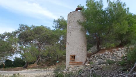 view of approaching an old smelting furnace in the woods