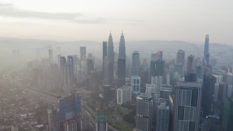 kuala lumpur at sunrise, aerial view of the city skyline including the famous petronas twin towers, malaysia.
