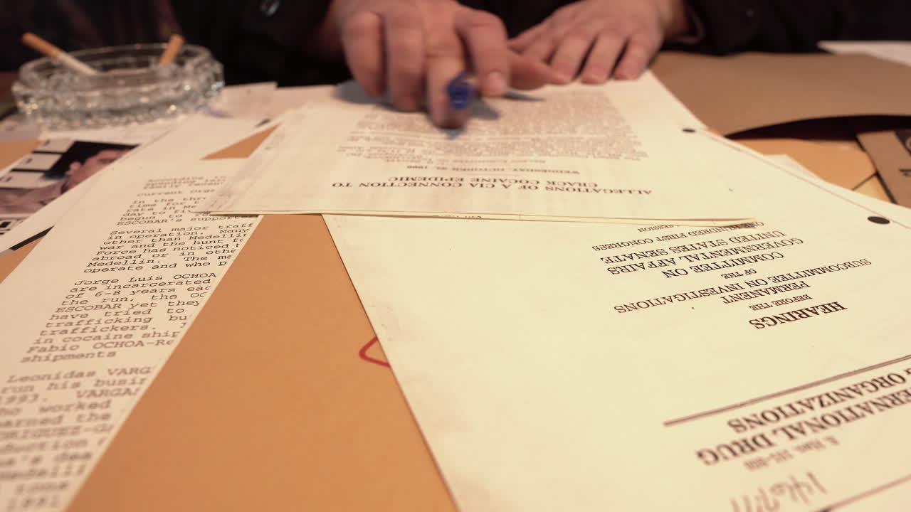 American Federal Agents Looking at Investigation Documents and Top Secret Files, Close Up