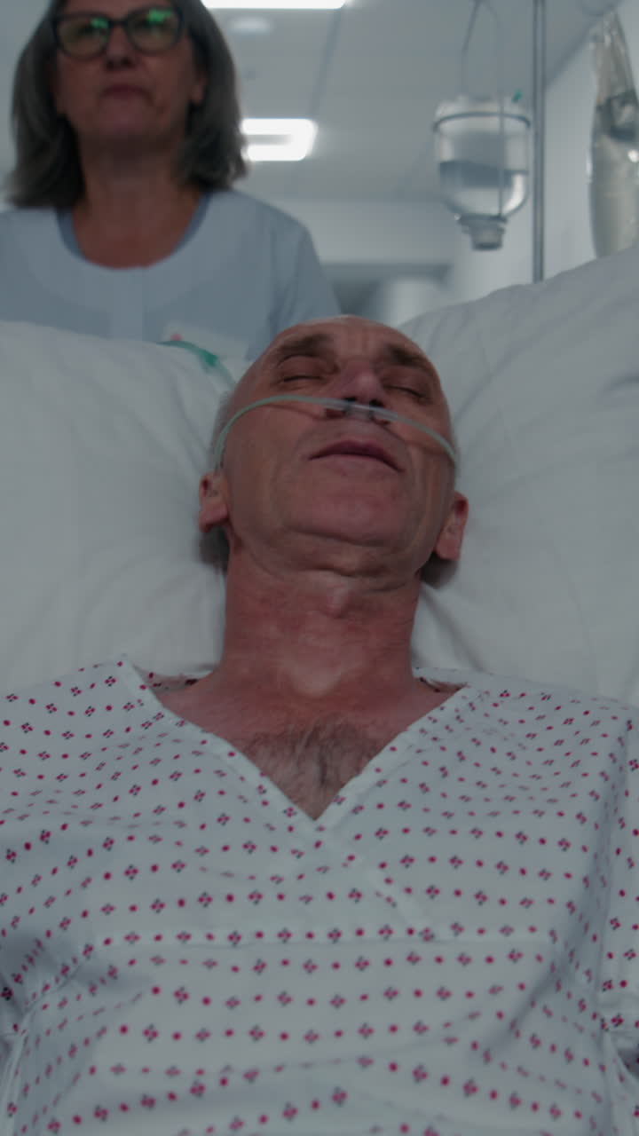 Mature medic pushes senior patient on gurney to su 4k 2025 08 04 05 16 03 utc.mov | african american, breathing tube, care, caucasian