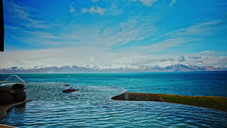 outdoor icelandic thermal spa with breathtaking view of the nordic ocean and majestic snowy mountains the distance