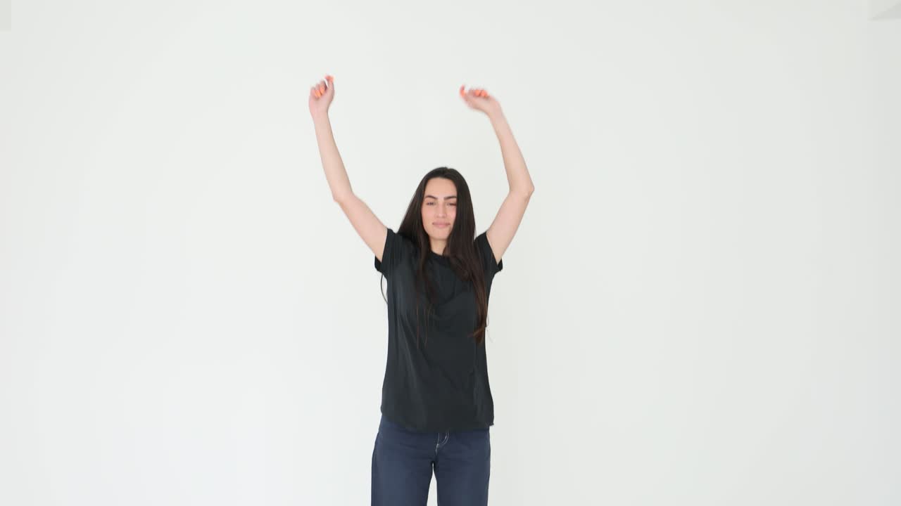 Woman in Black T-shirt with Arms Raised