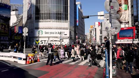 pedestrians crossing a busy urban intersection