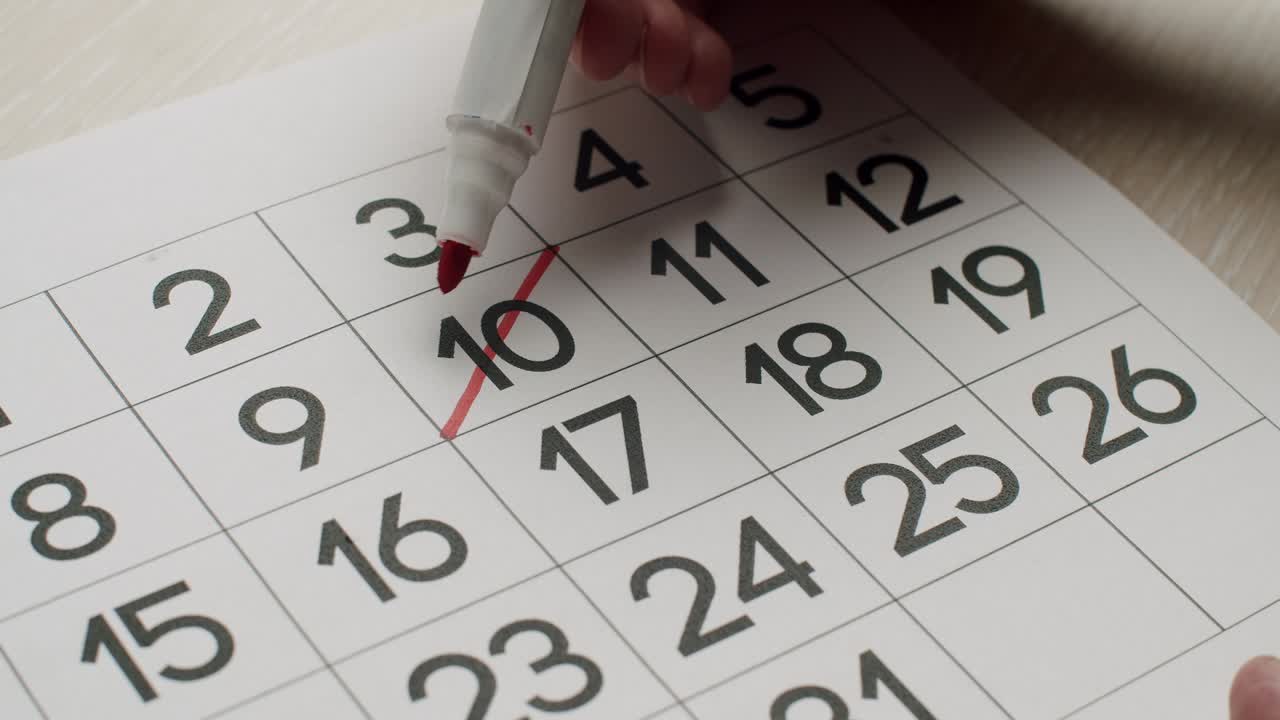 calendario 10o día del mes tachado. firmar un día en un calendario.