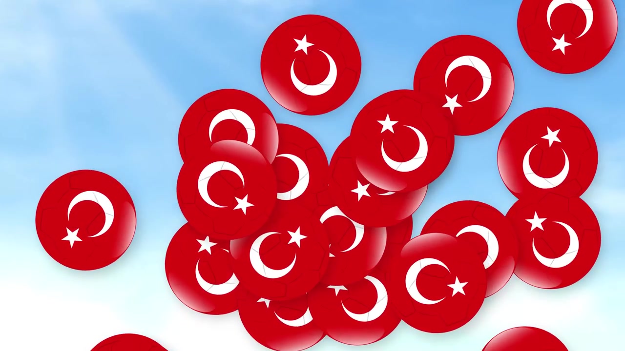 Ulusal sembollü kırmızı küreler, yumuşak bulutlu parlak mavi bir gökyüzünden düşüyor.